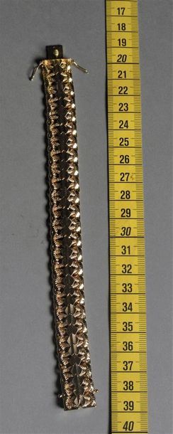 null Bracelet ruban articulé en or jaune 18K (750°/°°). Poids : 32,1 g