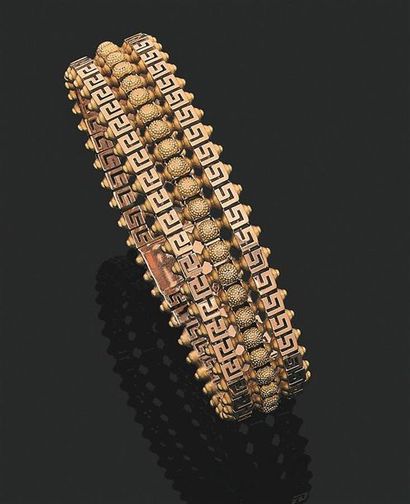null Bracelet en or jaune 750 millièmes à mailles ajourées de deux frises de grecques...