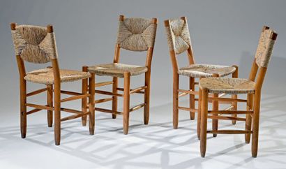Charlotte PERRIAND (1903-1999) Suite de quatre chaises n°19, structure en bois naturelle,...