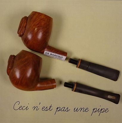 null BUTZ CHOQUIN France Deux pipes en bruyère sculptée à décor de profiles de chien,...