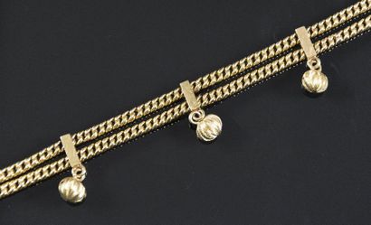 null Bracelet souple en or jaune 18K (750°/°°) à deux rangs de maille américaine,...