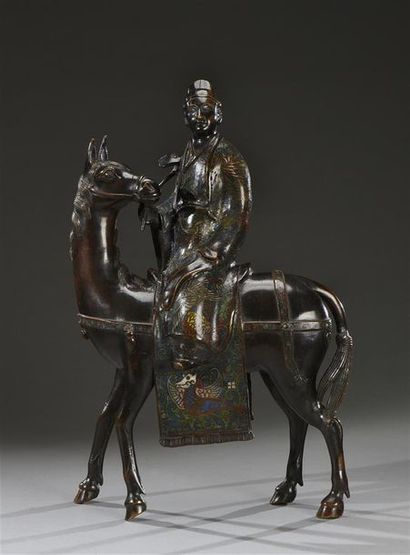 CHINE - fin du XIXe siècle Toba sur sa mule
Bronze patiné et émaux cloisonnés
H....