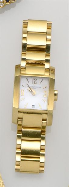 BAUME & MERCIER Montre en or jaune 18K (750°/°°) collection «Diamant», lunette facettée,...