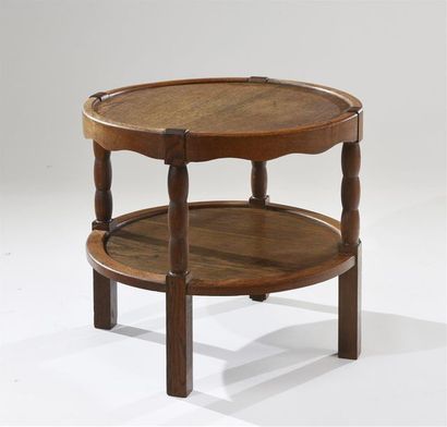 CHARLES DUDOUYT (1885-1946) 
Guéridon circulaire en bois teinté à deux plateaux,...