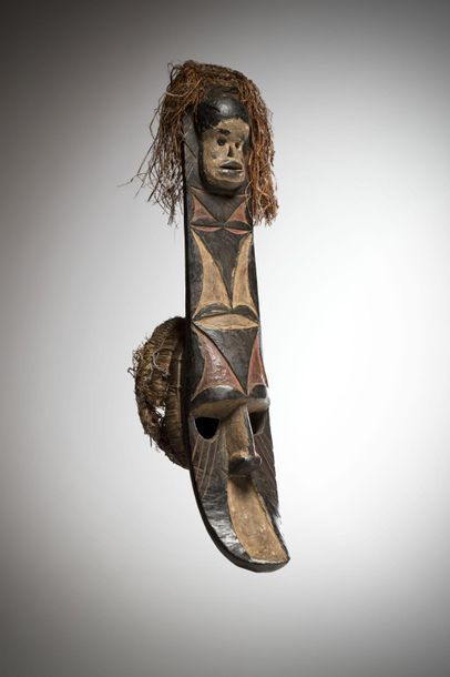 null AFIKPO, Nigeria. Polychrome mask with a concave face surmounted by a geometrically...