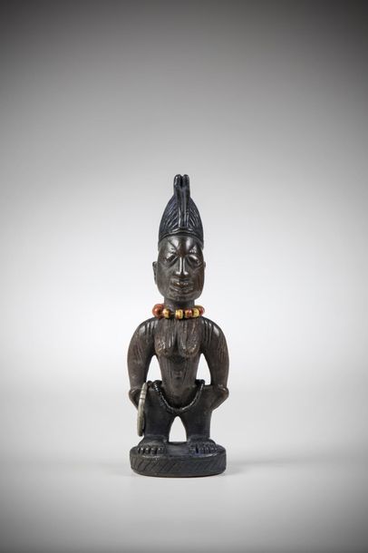 null YORUBA, Nigeria. Female representation whose shoulders and breasts are scarified...