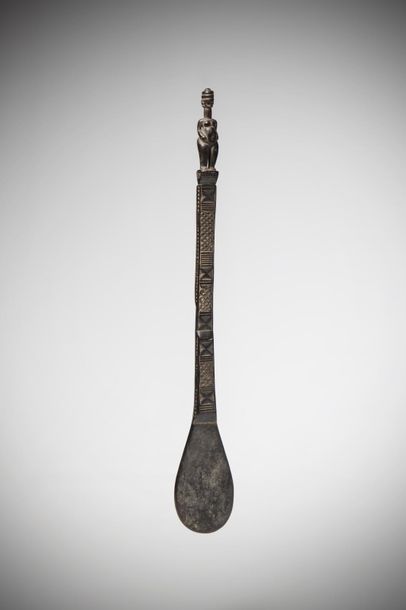 null KWERE, Tanzania. Dark wood spatula with a patina of use. The handle engraved...