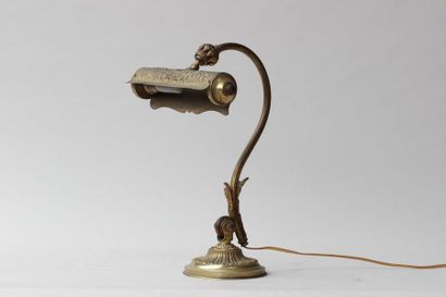 null DESK LAMP in bronze and gilt metal with articulated shade, first half of the...
