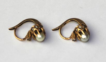 Pair of earrings each decorated with a pearl...