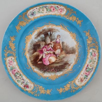 null FLAT of round shape in porcelain enamelled with a country scene and bouquets...