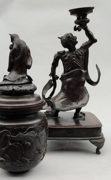 null Large PERFUM BURNER in brown patinated bronze representing a deity supporting...