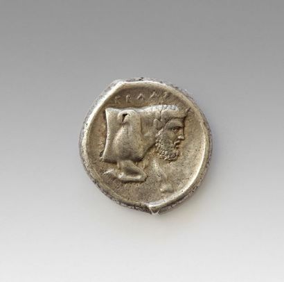 null GELA
Tetradrachme
obverse: quadrige on the left step crowned by a victory 
Reverse:...