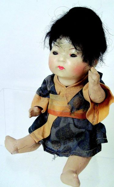null Small German baby with a full pipe clay head, closed mouth, brown glass sleeping...