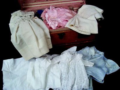 null Doll's trunk with three dividers and many small size clothes including 10 dresses,...