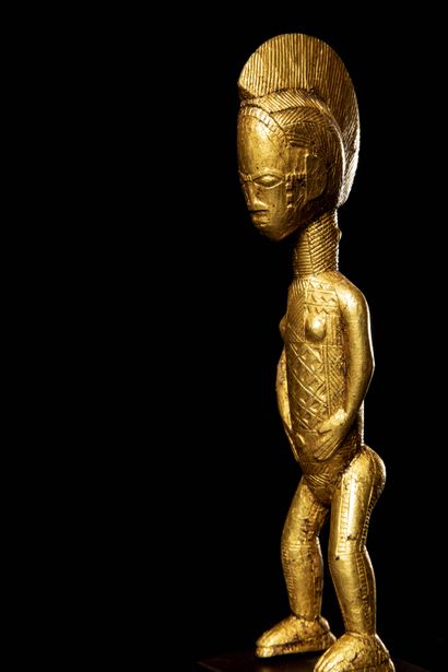 null BAOULE (Ivory Coast)

Elegant feminine STATUETTE in wood covered with gold leaf....