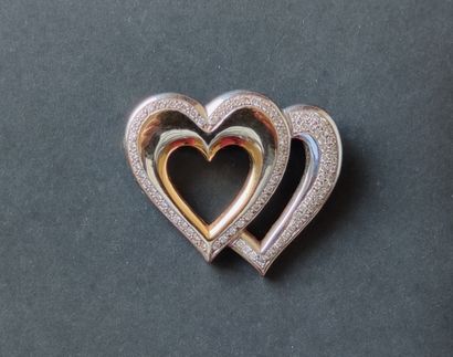 null 
Double "hearts" brooch in yellow and white gold 750°/°°° set with entourages...