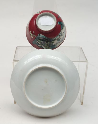 null 
Bowl and its porcelain saucer with reserve decoration on a red background of...