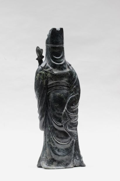 null 
STATUE in spinach green hard stone representing a standing dignitary holding...