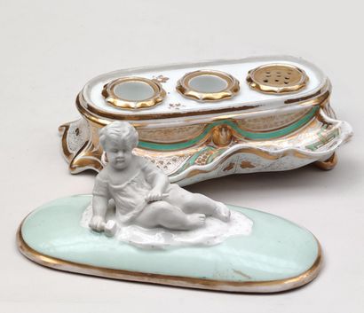 null 
PARIS
Covered china inkwell enamelled pale green and gilded, the lid uncovering...