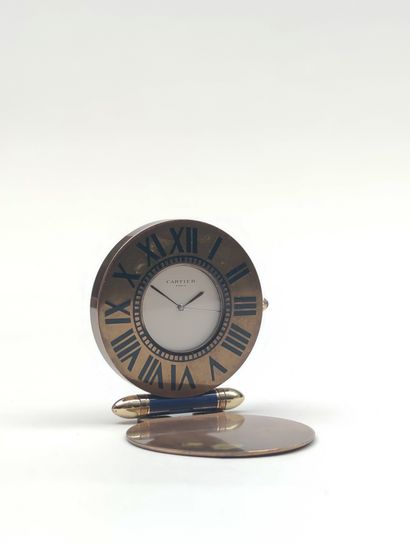 null 
CARTIER
Travel clock, quartz movement, Diameter : 5.5 cm (movement out of ...