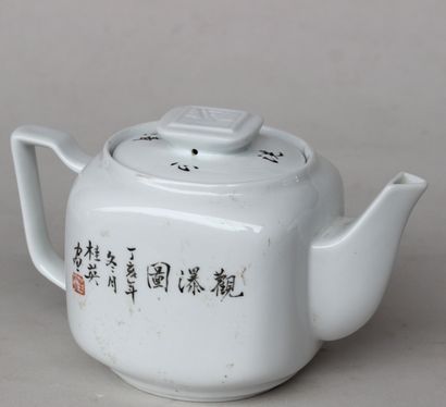 null 
A square porcelain teapot with enamelled landscape and ideograms decoration,...