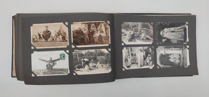 null 
Two ALBUMS of old postcards on regionalism, gallant subjects, new year, et...