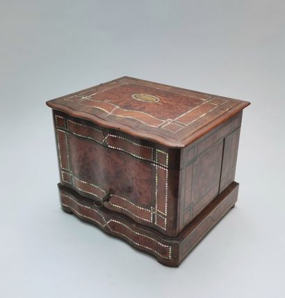 null 
Wooden veneer and marquetry liquor cabinet with its glassware interior on a...