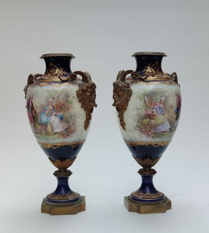 null 
A pair of polychrome enamelled porcelain VASES of baluster shape with scenes...