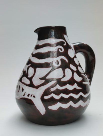 null 
Jean LURCAT (1892-1966)
White enamelled ceramic pitcher on a brown background...