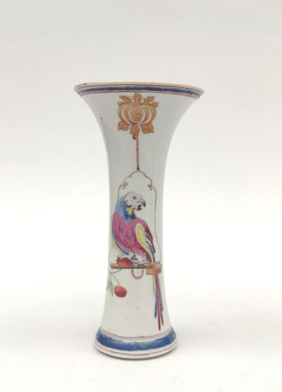 null 
A small porcelain VASE of tubular form with a horn-shaped neck, decorated with...