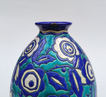 null 
KERAMIS
A polychrome enamelled ceramic vase of stylized blue and yellow flowers...