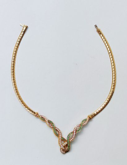 null 
Necklace in yellow gold 750 °/00 with a falling interlace pattern, decorated...