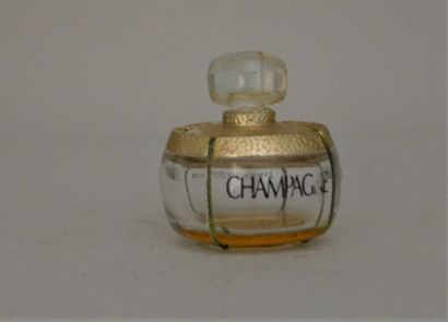 null 
Yves Saint Laurent - "Champagne" 

Flacon publicitaire décoratif en verre 

h...