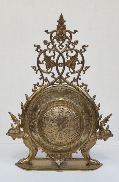 null 
A chased bronze clock, gilded and openworked, edited by F. BARBEDIENNE, with...
