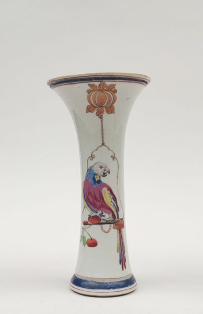null A small porcelain VASE of tubular form with a horn-shaped neck, decorated with...
