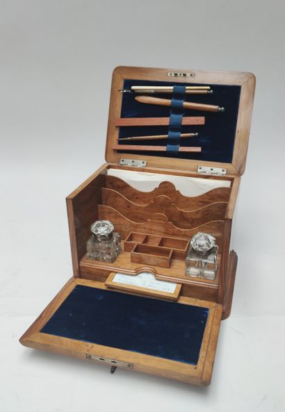 null Rectangular writing case in light wood opening with a lid and a flap revealing...