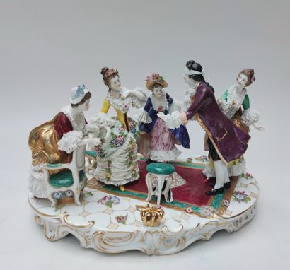 null GROUP in polychrome enamelled porcelain representing a meeting of four young...