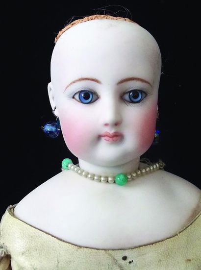 null Beautiful Parisian doll with swivel head in pressed bisque from the house of...
