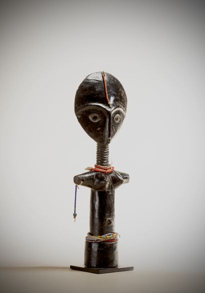 null ASHANI (Ghana)

Akwa-ba fertility doll with glass bead pendants on the arm and...