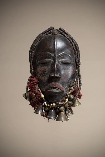 null DAN (Ivory Coast)

Mask with thin slit eyes, the superciliary arches, the upper...