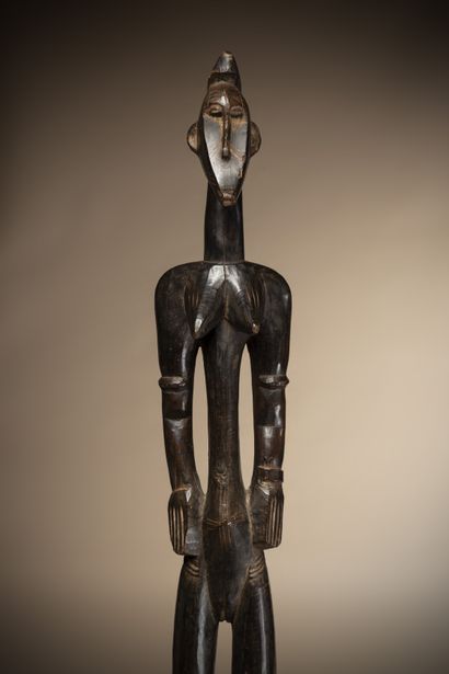  SENOUFO (Ivory Coast, Mali) 
Elegant female statue with a thin, concave face, used...