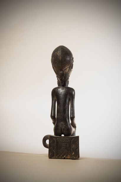 null BAOULE (Ivory Coast)

female statue sitting on the traditional seat with handle,...