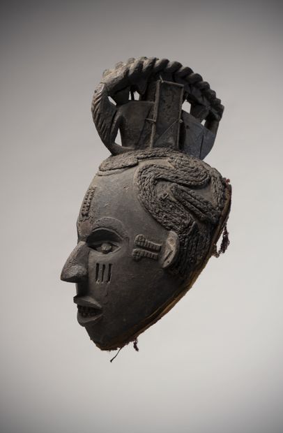 null IBO (Nigeria)

Helmet mask with openwork eyes, the scarification marks on the...