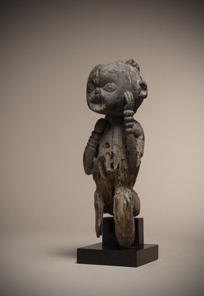 null M'BEMBE (Nigeria)

Very old statue in a seated position, one arm joining the...
