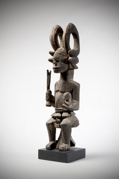 null IBO (Nigeria)

Seated male statue linked to the Igenka cult. She is holding...