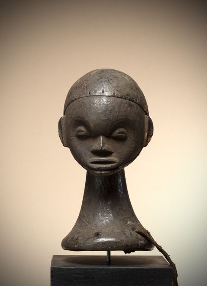 null IDOMA (Nigeria)

Ungali" dance crest representing a spherical head on a flared...