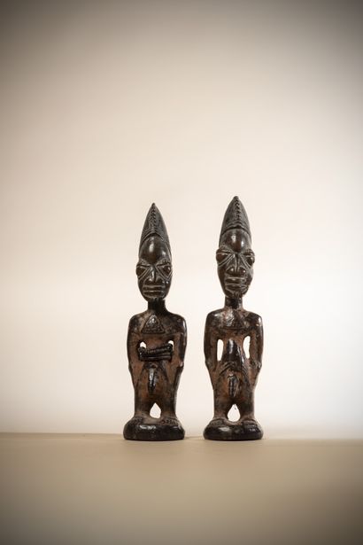 null YORUBA (Nigeria)

Pair of Ibedji twins wearing a triangular pectoral, deep lacquered...