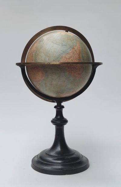 GLOBE on foot in blackened wood and brass...