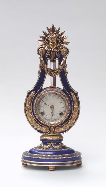 Porcelain clock and gilt metal ornament,...