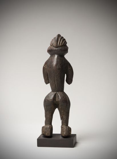 null Wéré ? Bassa Ngé ? (Nigeria) Female statue in dense wood with a dark patina....